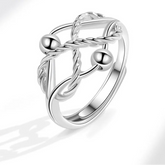 Auralis fidget jewelry close-up - luminous stress ring