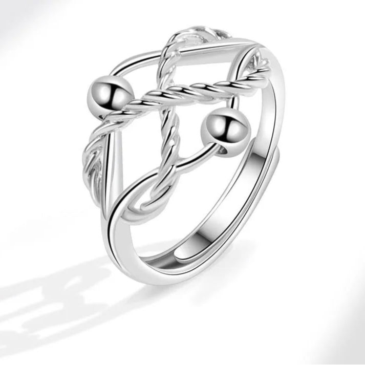 Auralis fidget jewelry close-up - luminous stress ring