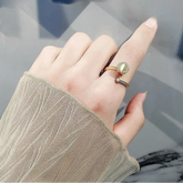 Aurian fidget band on finger - golden stress jewelry